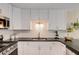 Well-appointed kitchen with white cabinets, granite countertops, stainless steel appliances, and ample storage space at 263 Keller Dr, Mcdonough, GA 30252
