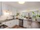 Bright kitchen with white cabinets, stainless steel appliances, and a cozy breakfast nook with natural light at 263 Keller Dr, Mcdonough, GA 30252