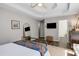 Open bedroom with tray ceiling, ceiling fan and view to ensuite bathroom at 263 Keller Dr, Mcdonough, GA 30252