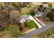 Aerial view showcases a bright home with fresh landscaping and a new driveway at 4440 Cannon Rd, Loganville, GA 30052