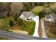 Overhead view of the home, manicured lawn, new driveway and minimalist landscaping at 4440 Cannon Rd, Loganville, GA 30052