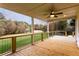 Back deck featuring wood decking, metal railings and ceiling fan at 4440 Cannon Rd, Loganville, GA 30052
