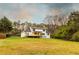 Wide view of back exterior and large manicured lawn at 4440 Cannon Rd, Loganville, GA 30052