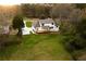 Aerial view shows the back of the house with the new deck and landscaping at 4440 Cannon Rd, Loganville, GA 30052