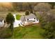 A view of the back of the home with a back deck and big lawn at 4440 Cannon Rd, Loganville, GA 30052