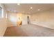 Spacious basement area leading to stairs and doorway at 4440 Cannon Rd, Loganville, GA 30052