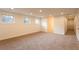 Unfinished basement with three windows and neutral carpet at 4440 Cannon Rd, Loganville, GA 30052