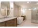 A luxurious bathroom features a soaking tub, separate vanities, and a glass-enclosed shower at 4440 Cannon Rd, Loganville, GA 30052