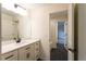 Bathroom features a vanity with bright countertop and access to bedroom and shower at 4440 Cannon Rd, Loganville, GA 30052