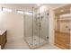 This bathroom features a glass-enclosed shower and a view into the walk-in closet at 4440 Cannon Rd, Loganville, GA 30052