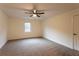 Bedroom featuring plush carpet, ceiling fan and a bright window at 4440 Cannon Rd, Loganville, GA 30052