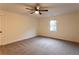 Bedroom featuring plush carpet, ceiling fan and a bright window at 4440 Cannon Rd, Loganville, GA 30052