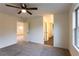 Bright bedroom features neutral carpet and doorway to an adjacent room at 4440 Cannon Rd, Loganville, GA 30052