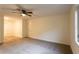 Spacious carpeted bedroom featuring a ceiling fan and bright natural light at 4440 Cannon Rd, Loganville, GA 30052