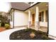 Home exterior featuring stone accents around the columns at the front entrance and dark shutters at 4440 Cannon Rd, Loganville, GA 30052