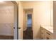 Hallway view to walk-in closet and bathroom at 4440 Cannon Rd, Loganville, GA 30052