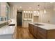 Bright kitchen with white cabinets, quartz countertops, and stainless steel appliances at 4440 Cannon Rd, Loganville, GA 30052