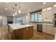 Kitchen featuring an island, hardwood floors, and stainless steel appliances at 4440 Cannon Rd, Loganville, GA 30052