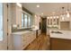 Modern kitchen boasts stainless steel appliances, quartz countertops, and ample cabinet space for storage at 4440 Cannon Rd, Loganville, GA 30052