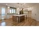 Well-lit kitchen showcasing a large island, stainless steel appliances, and plenty of storage at 4440 Cannon Rd, Loganville, GA 30052