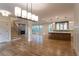 Spacious living area with hardwood floors, fireplace, and open floor plan to the kitchen for entertaining at 4440 Cannon Rd, Loganville, GA 30052