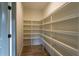 Walk-in pantry with custom shelving for optimal storage at 4440 Cannon Rd, Loganville, GA 30052