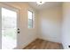 Sun-lit room featuring a glass exterior door to a deck and a bright window at 4440 Cannon Rd, Loganville, GA 30052