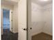 Open walk-in closet with white wire shelves and plush neutral carpet at 4440 Cannon Rd, Loganville, GA 30052