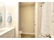 Compact bathroom featuring a white toilet, sink, and shower at 910 Shannon Mist Dr, Loganville, GA 30052