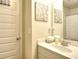 Modest bathroom featuring a single vanity and a neutral color palette at 910 Shannon Mist Dr, Loganville, GA 30052