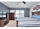 Modern bedroom with a gray accent wall, comfortable bed, and large window for ample natural light at 910 Shannon Mist Dr, Loganville, GA 30052