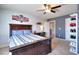 Stylish bedroom featuring a brick accent wall, dark wood furniture, and a built-in shoe rack at 910 Shannon Mist Dr, Loganville, GA 30052