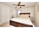 Bedroom with a ceiling fan, closet and a bedside table at 910 Shannon Mist Dr, Loganville, GA 30052