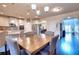 Inviting dining area with hardwood floors and a view to the kitchen at 910 Shannon Mist Dr, Loganville, GA 30052