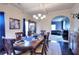 Formal dining room with hardwood floors, and view to an adjacent sitting room at 910 Shannon Mist Dr, Loganville, GA 30052