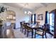 Dining room featuring a wooden table, hardwood floors, and a china cabinet at 910 Shannon Mist Dr, Loganville, GA 30052