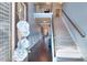 Elegant home entryway showcasing staircase, dark wood floors, and upper level landing at 910 Shannon Mist Dr, Loganville, GA 30052