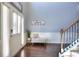 Elegant foyer with hardwood floors, staircase, and stylish decor, creating a welcoming entry at 910 Shannon Mist Dr, Loganville, GA 30052