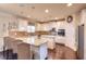 Kitchen with white cabinets, granite countertops, stainless steel appliances, and hardwood floors at 910 Shannon Mist Dr, Loganville, GA 30052