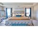 Serene main bedroom featuring a king-sized bed, elegant decor, and plenty of natural light at 910 Shannon Mist Dr, Loganville, GA 30052