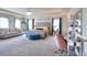 Spacious main bedroom with sitting area, plush carpet, and windows providing ample natural light at 910 Shannon Mist Dr, Loganville, GA 30052