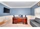 Spacious office showcases a large desk, comfortable seating, and modern decor for a productive work environment at 910 Shannon Mist Dr, Loganville, GA 30052