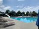 Resort-style community pool features a waterslide, chairs, and a gazebo, perfect for relaxation and recreation at 910 Shannon Mist Dr, Loganville, GA 30052