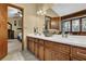 Large bathroom has double sink vanities and a view of the bedroom from the doorway at 2735 Peachtree Walk, Duluth, GA 30096