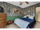 Charming bedroom featuring damask wallpaper, a plush bed, a dresser, and tasteful decor at 2735 Peachtree Walk, Duluth, GA 30096