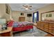 A bedroom features a dresser, bedside table, and lamps at 2735 Peachtree Walk, Duluth, GA 30096