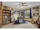 Eclectic bedroom featuring music posters, a drum set, guitar, and a cozy window view at 2735 Peachtree Walk, Duluth, GA 30096