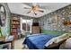 Bedroom with blue and green damask wallpaper, a vintage ceiling fan, and a cozy, comfortable interior at 2735 Peachtree Walk, Duluth, GA 30096