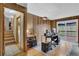 Bright home office features a wood-paneled wall, sliding glass doors to the deck, and an organized desk area at 2735 Peachtree Walk, Duluth, GA 30096