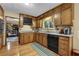 A kitchen features granite countertops, wooden cabinets, and stainless steel appliances at 2735 Peachtree Walk, Duluth, GA 30096